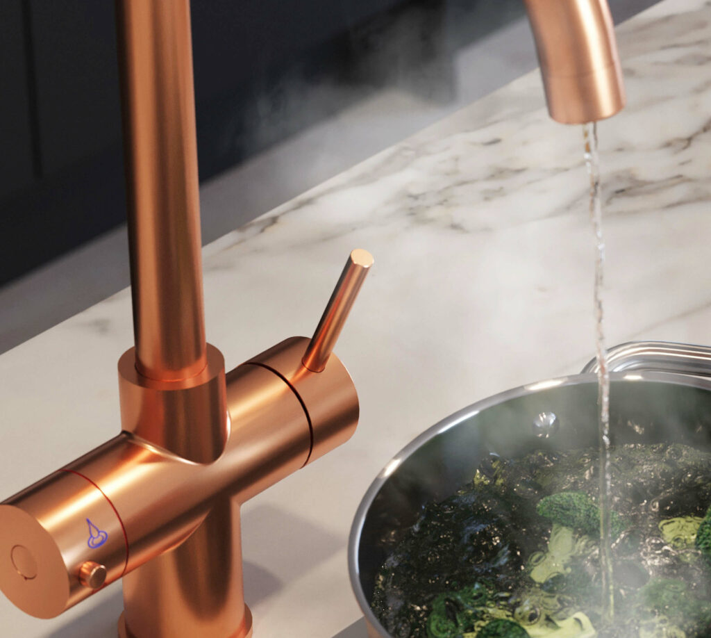 dispensing boiling water to a pan with broccoli from a swan neck copper boiling water tap