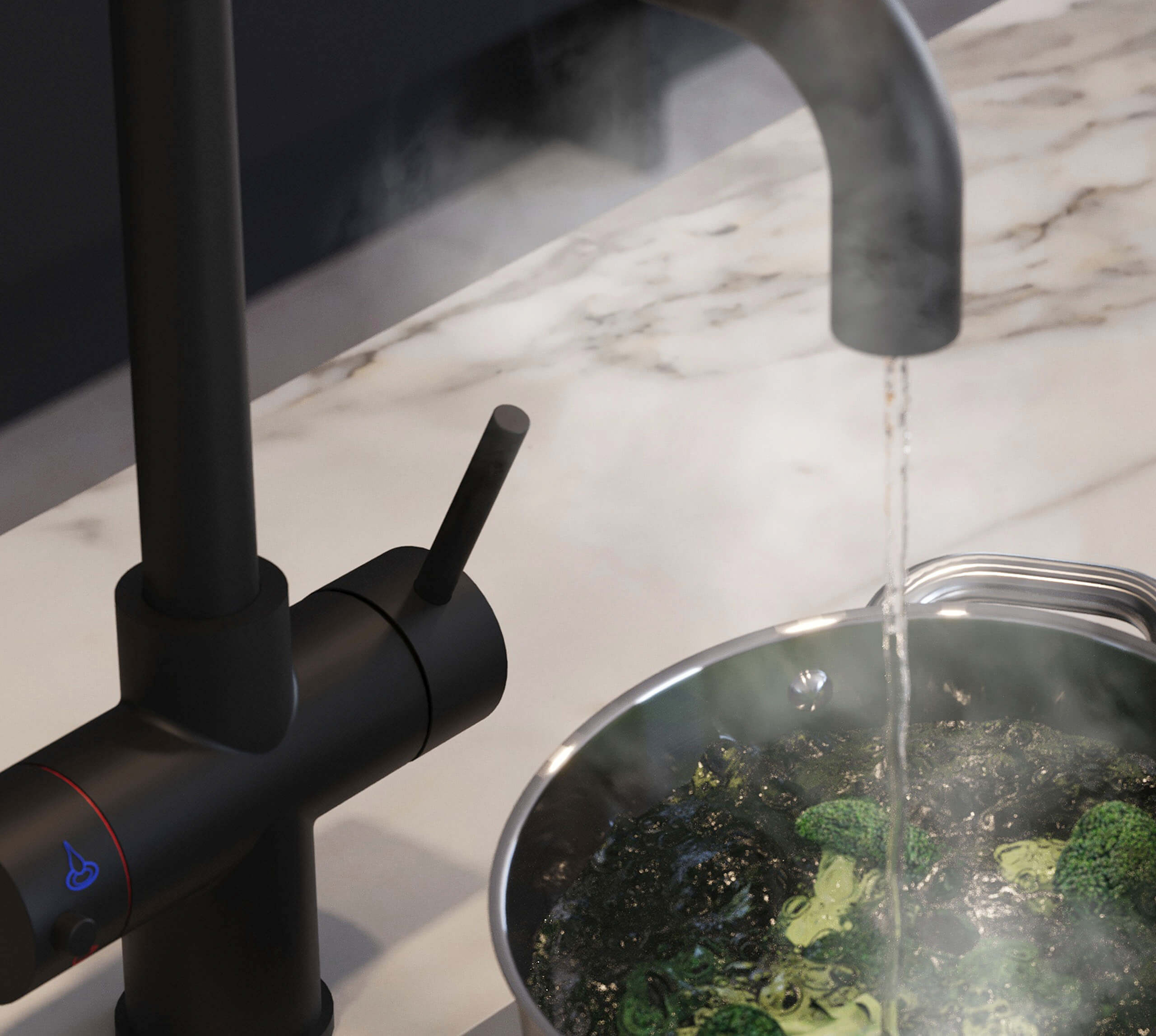 dispensing boiling water to a pan with broccoli from a D shape 3 in 1 matt black boiling and filtered water tap