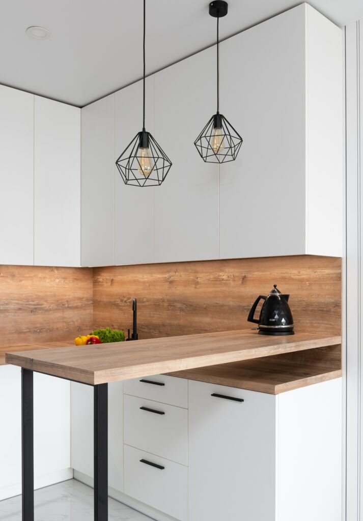 geometrical shimmering lamps over wooden kitchen table