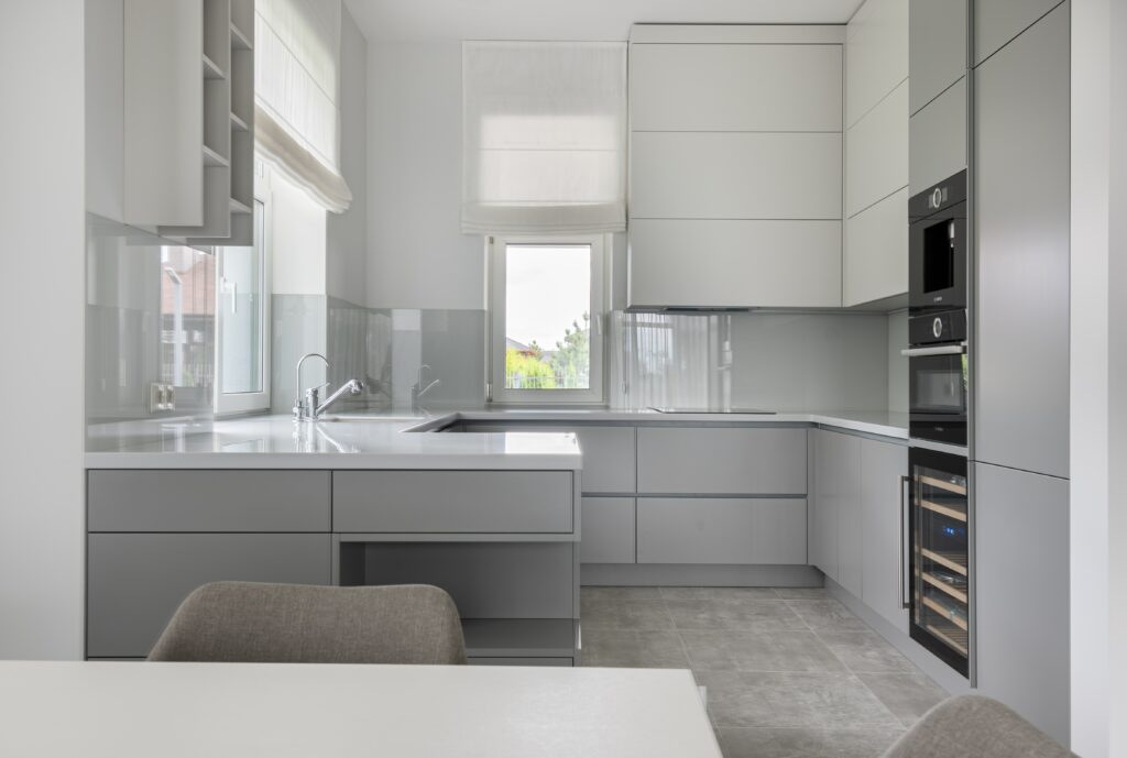 white cupboards alongside white table