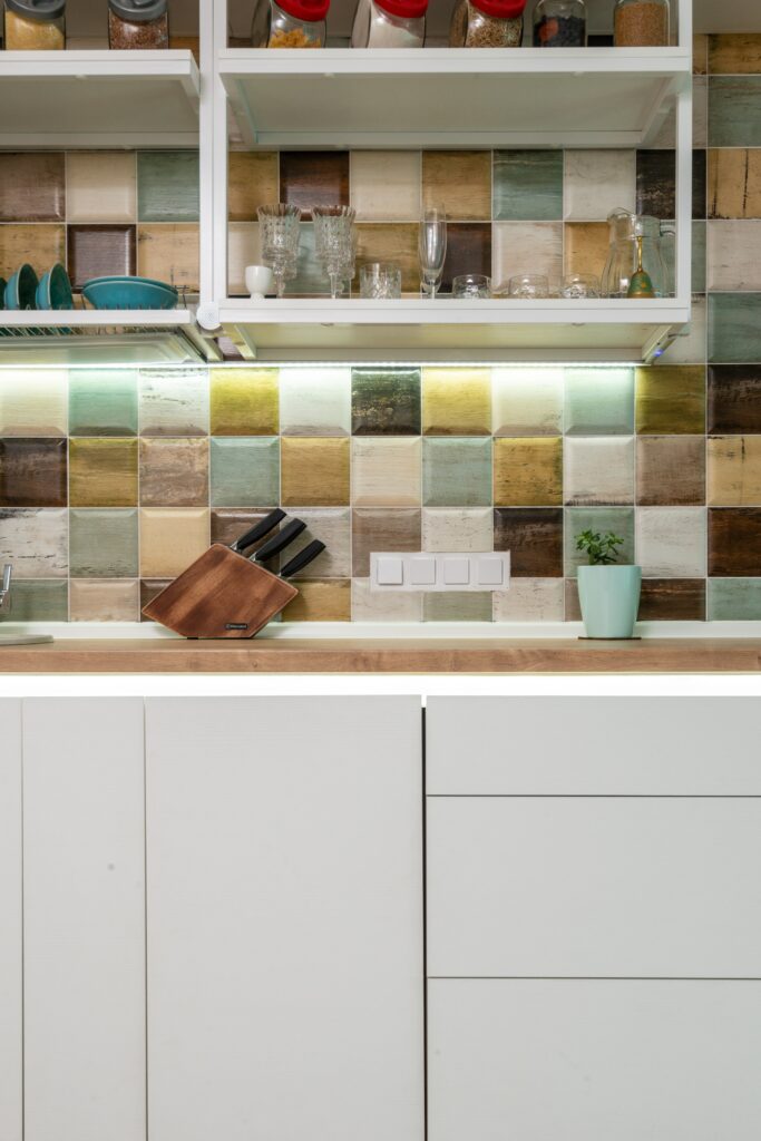 colourful kitchen tiles beside kitchen utensils