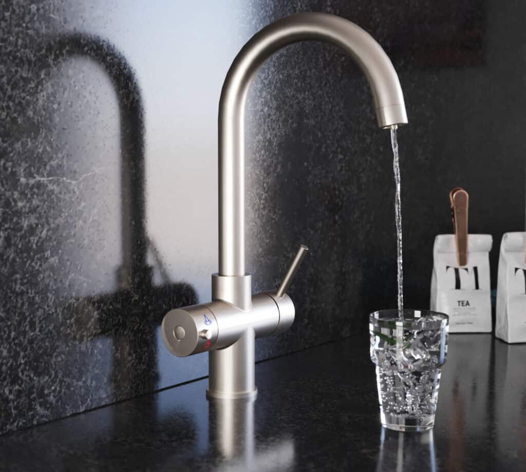 a brushed nickel swan neck water tap running water into a clear drinking glass