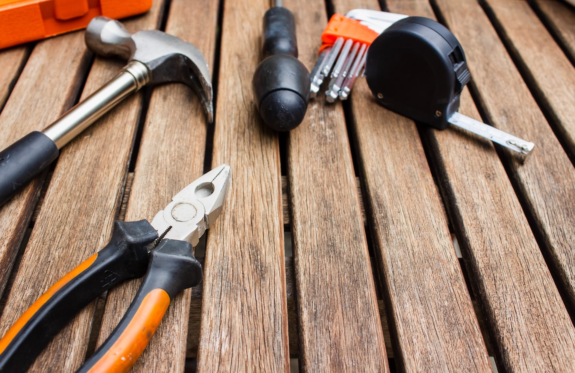 Tools laid out across a wooden floor