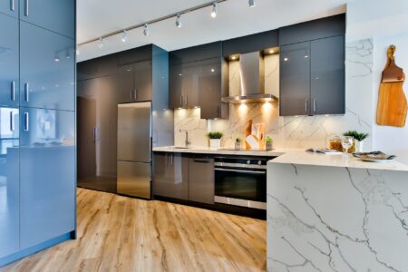 white and black kitchen with task lighting under cabinets