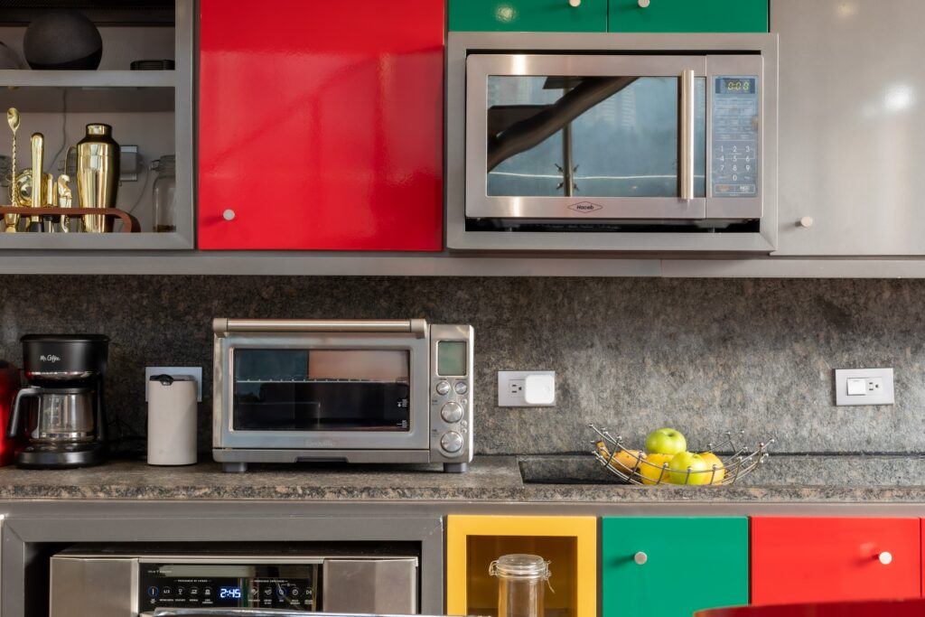 silver microwave oven on black kitchen worktop