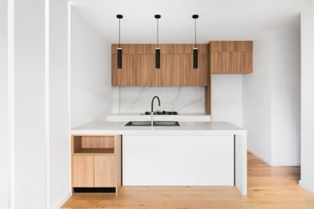 a kitchen with multipurpose wooden furniture