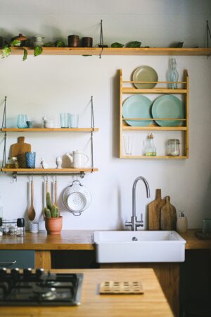 Kitchen Interior with Counter and Shelves with Utensils