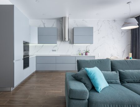 a grey kitchen inside a modern house