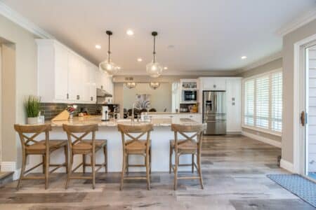 Four Brown Wooden Chairs in a modern kitchen