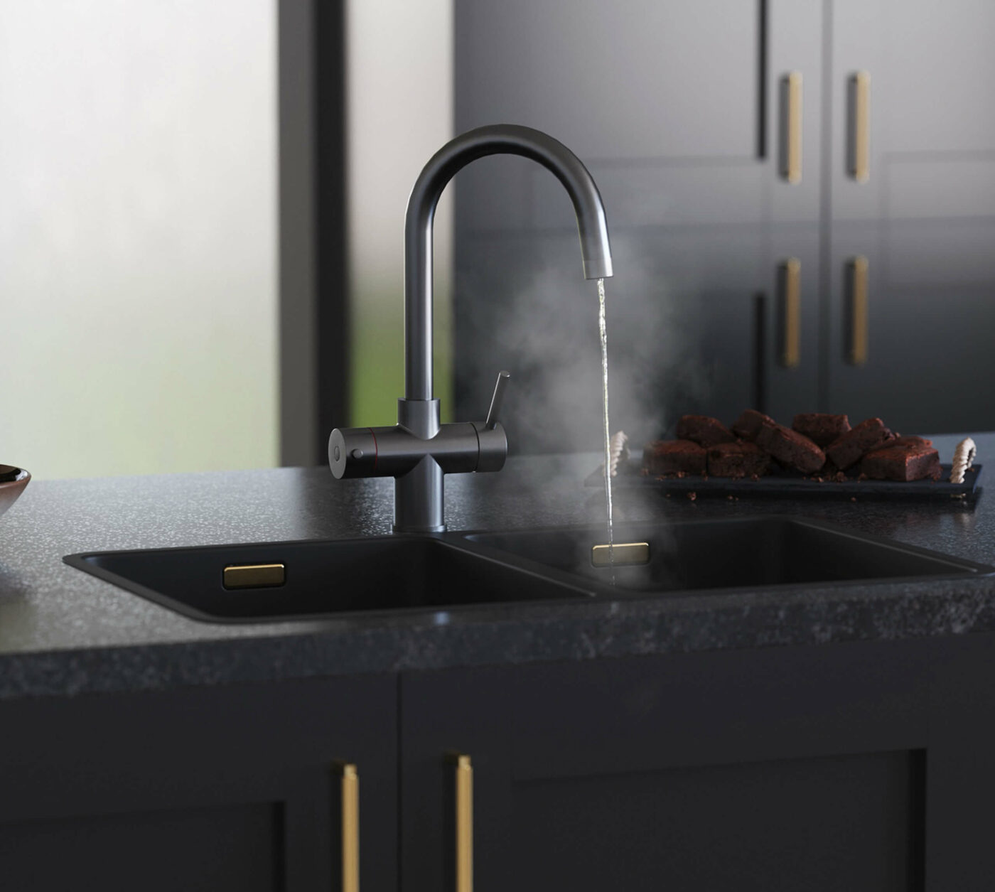 a swan neck gunmetal 4 in 1 kitchen tap dispensing hot water on a sink