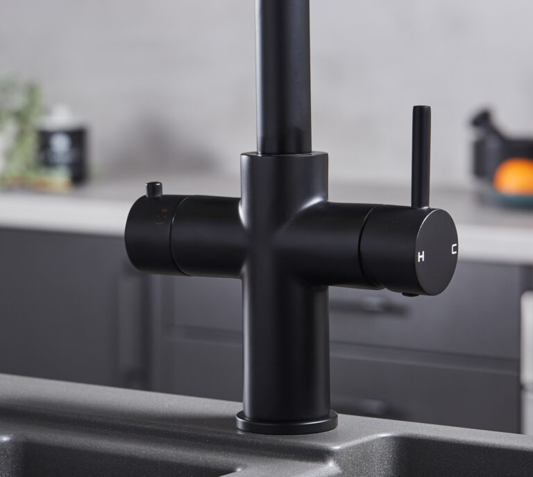 Close-up of a matte black hot tap handle