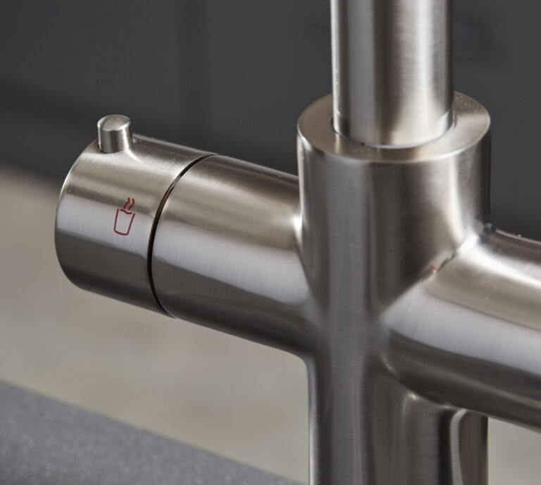 Close-up of a brushed nickel hot tap handle