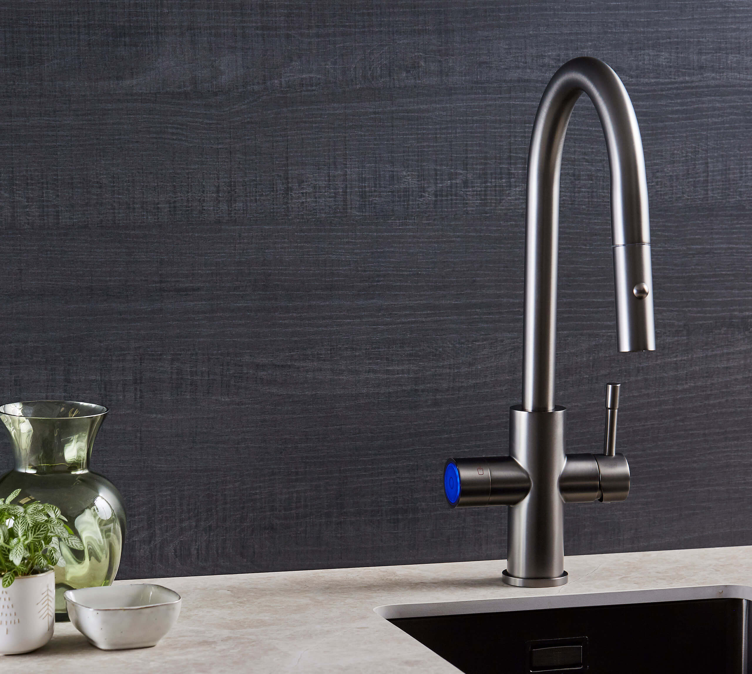 a gun metal black boiling water tap in a modern kitchen