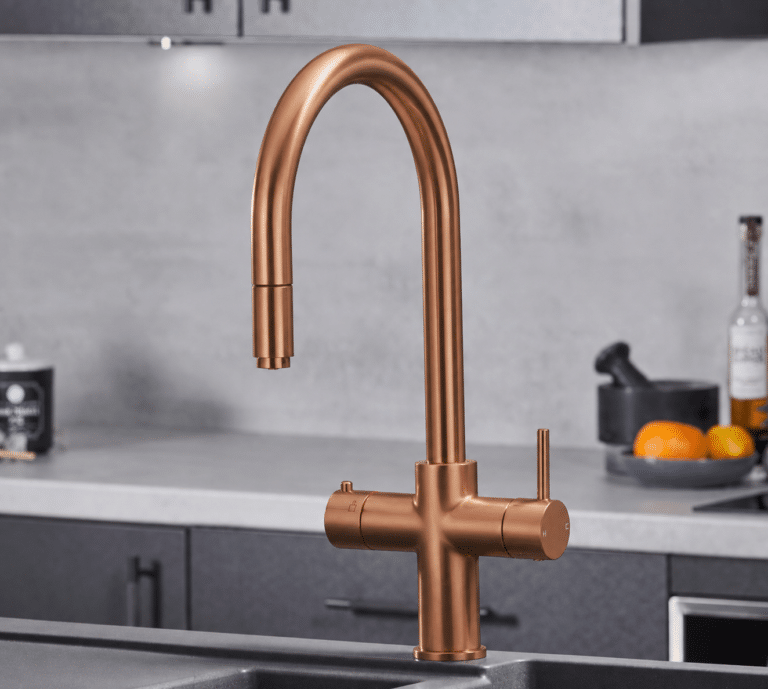 copper bronze boiling water tap in a modern kitchen